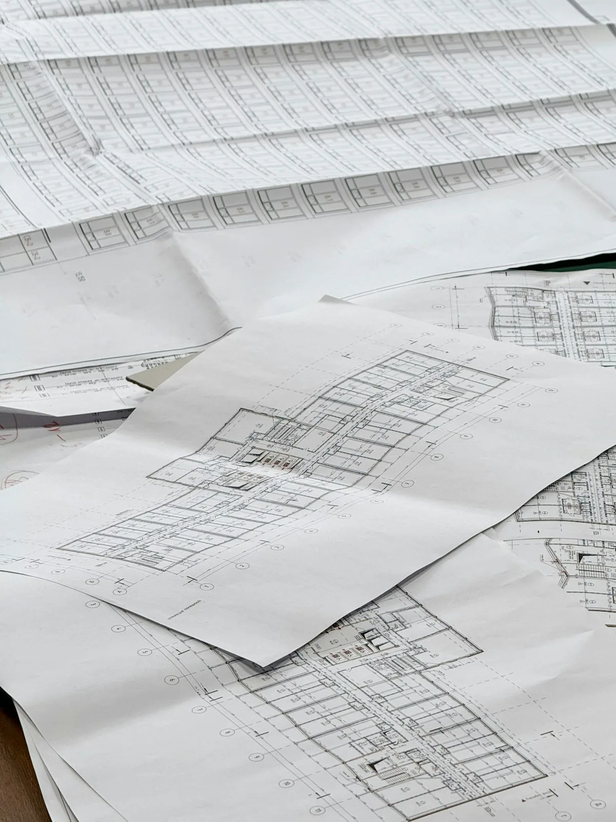 Architectural drawings spread across a table